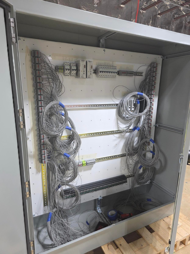 Electrical control cabinet being prepared for a project
